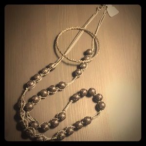 Intricate silver beaded necklace and bracelet